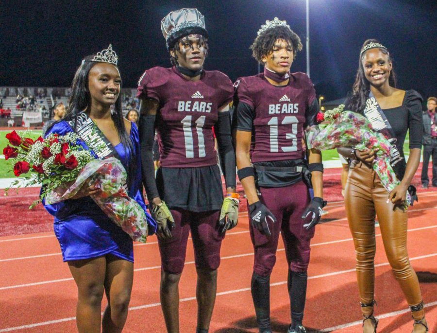 Hoemcoming roalty stands together in front of their student body. (From left to right) queen Cydney Blair and king Trent Baker-Booker pose next to prince DJ Morton and princess MiKya Bailey. 