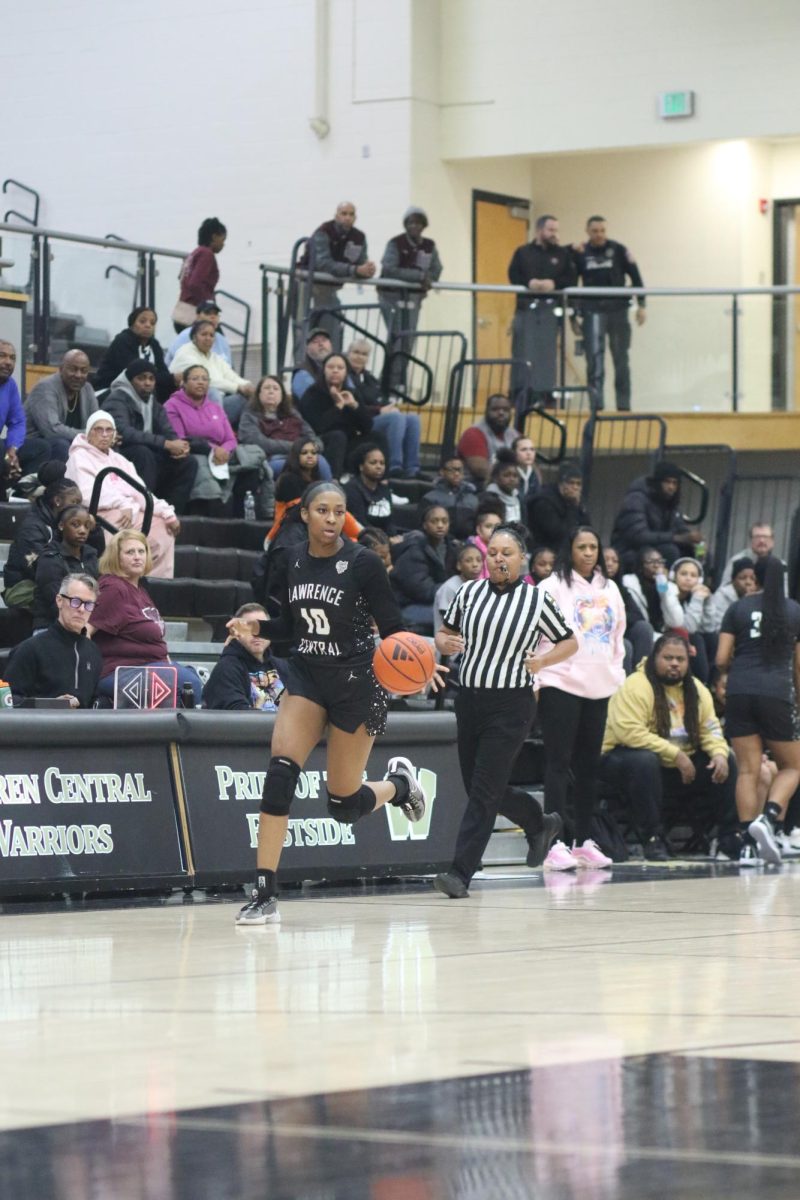 Jaylah Lampley, Senior, dribbles the ball up the court after getting a rebound.