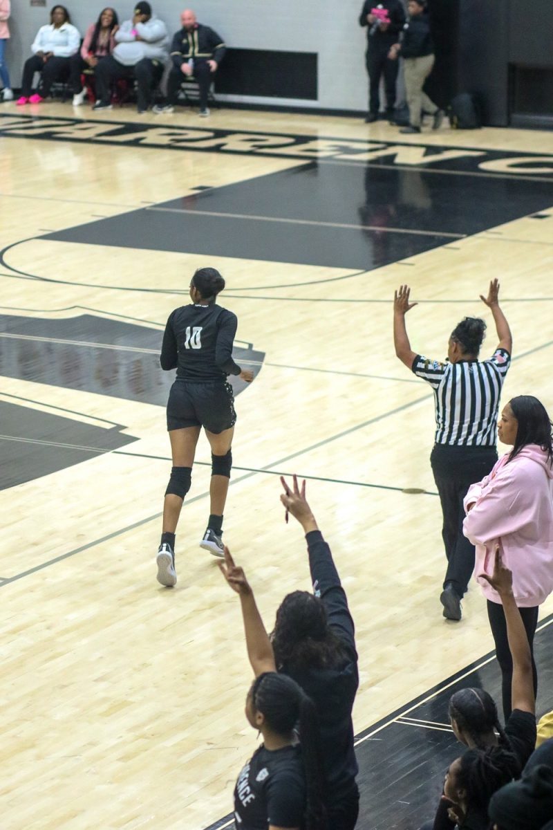 Jaylah Lampley, Senior, runs back to defense after making a 3 pointer.