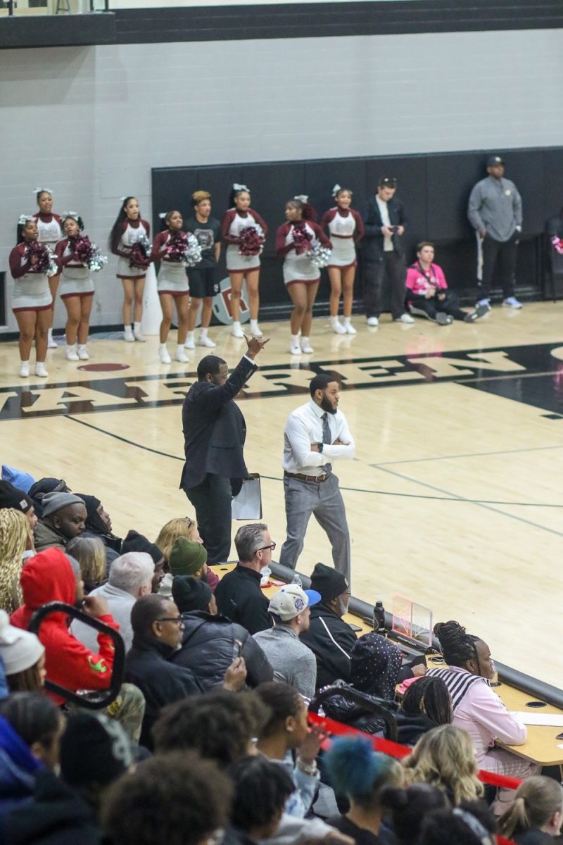 Coaches Jamares McCloud and Philip Washington tell their players what to do while on offense.