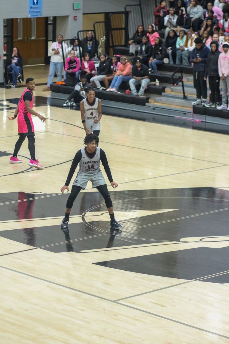 Bradley Mason, Senior, starts to play defense after hitting a layup on offense during the previous possession.