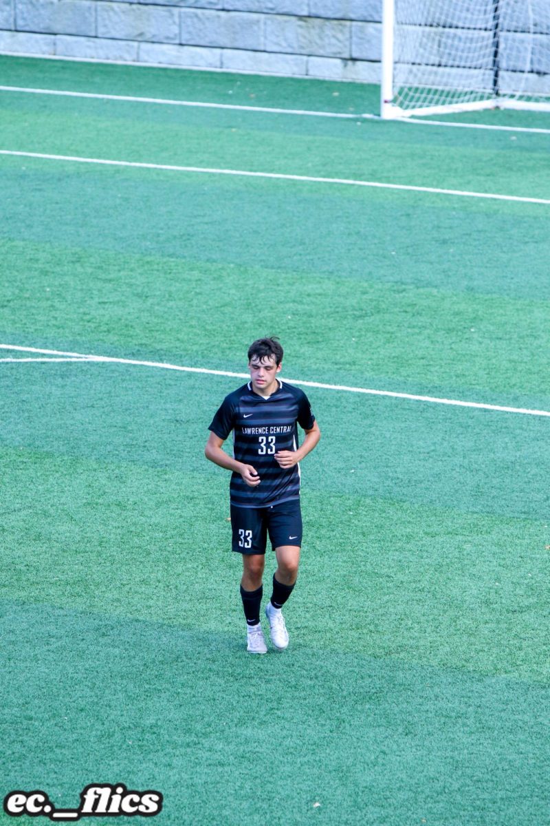 Cooper Jordan, Junior, runs to the sideline to get ready for a throw-in during the JV match vs Bishop Chatard.