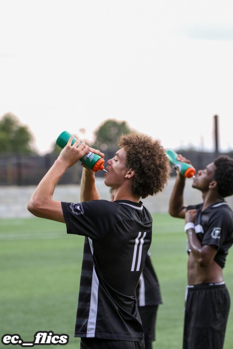 Bryce Bush, Sophomore, gets a drink of water during halftime vs Bishop Chatard.