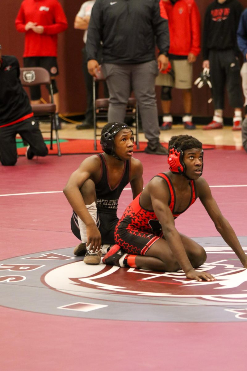 Zaiere, Sophomore, wrestles North Central's Madison Hamilton, Freshman, during the 1st round of the wrestling sectionals on January 31st.